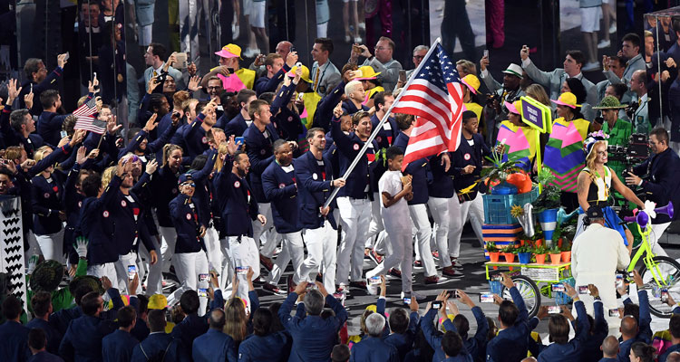 Olympic team holding US flag