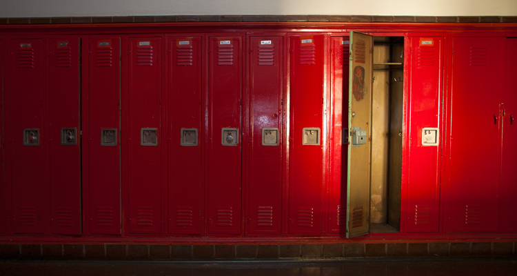 one empty locker among row of closed lockers