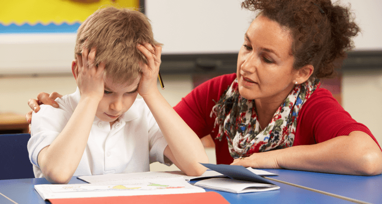 student helping stressed child