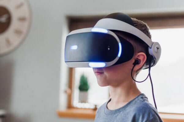 a boy using virtual reality technology to improve learning
