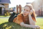 Teenage girl looking sad in the park