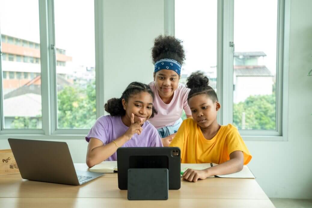 Young students learning on a computer