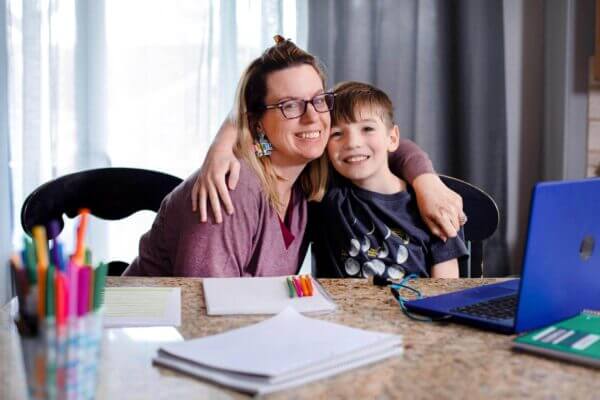Adult and child at desk