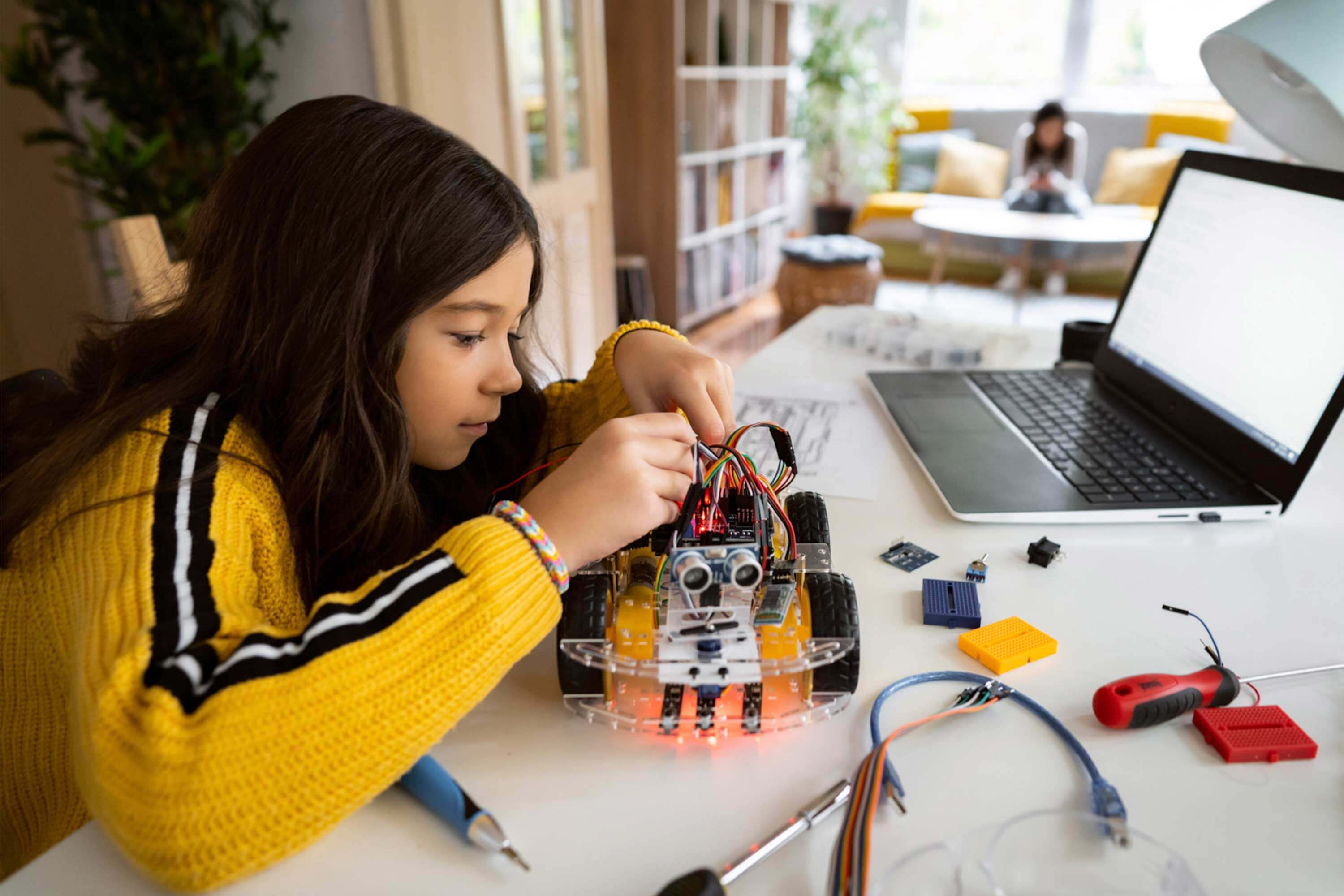 Student working her laptop at home
